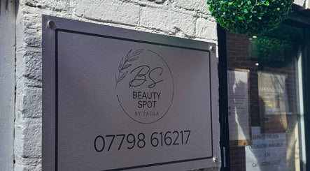 Metal sign of Beauty Spot By Paula at Bridgnorth, England, GB with contact details and greenery decor.