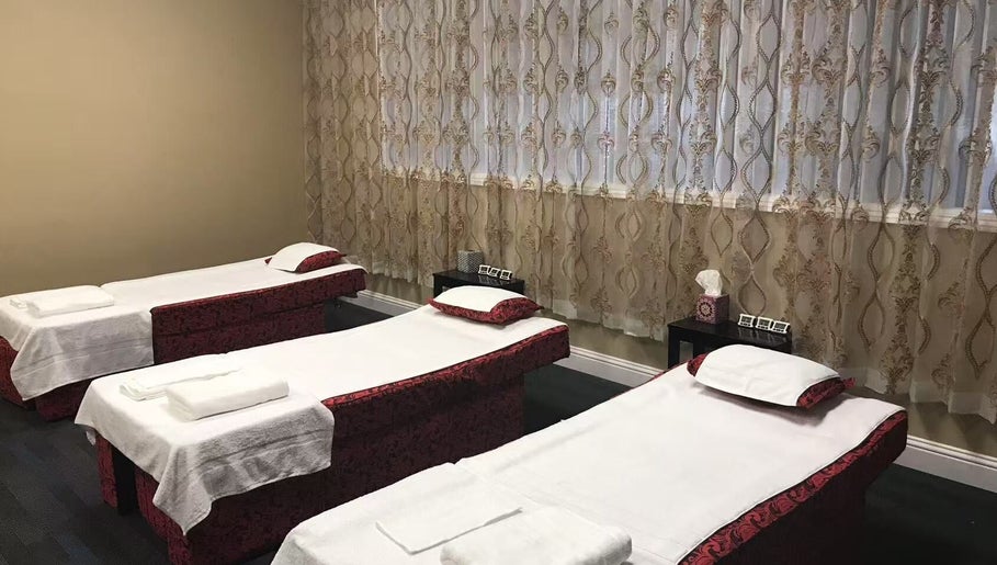 Three massage beds in a tranquil room at Warm Foot Spa, Atascadero, California, US.
