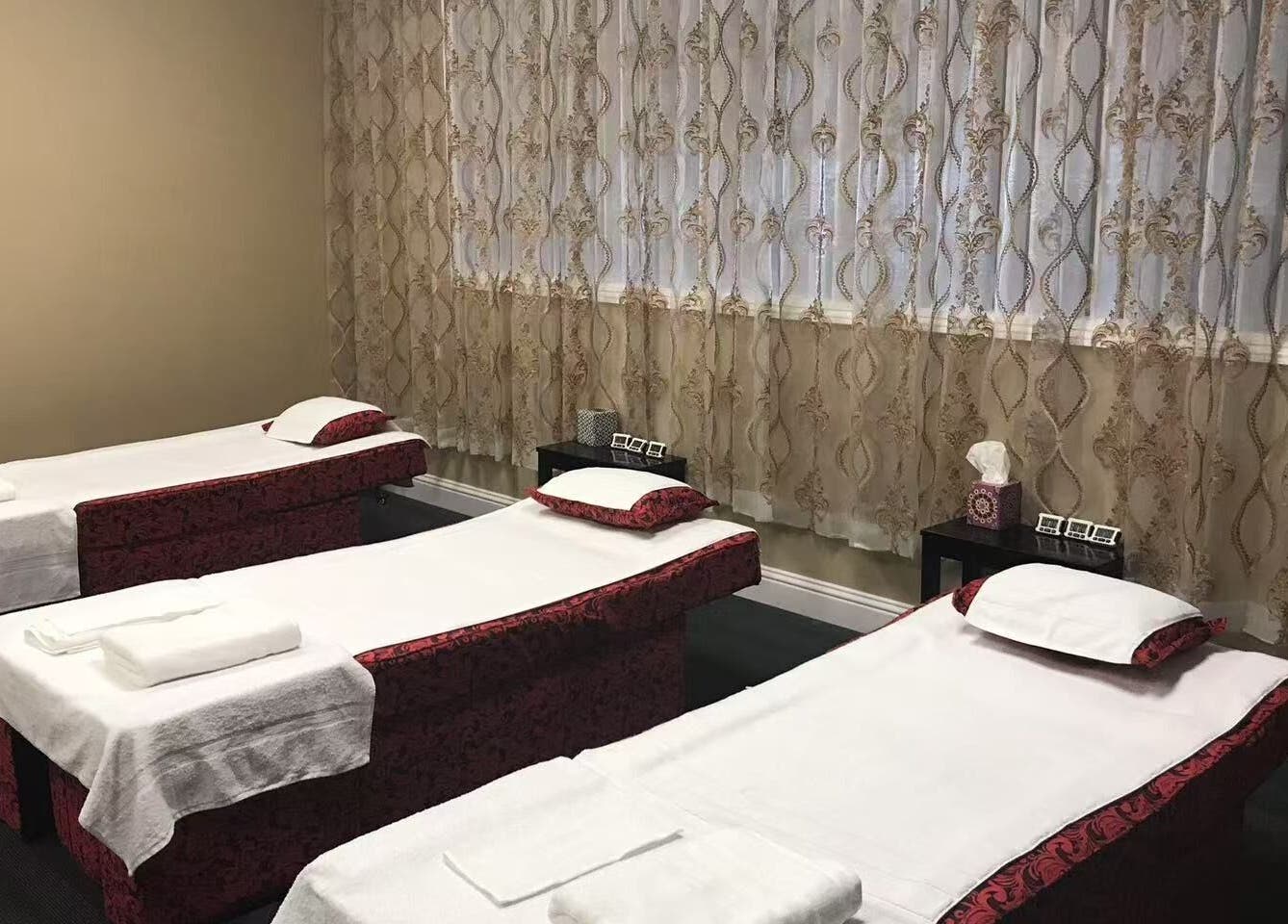 Three massage beds in a tranquil room at Warm Foot Spa, Atascadero, California, US.