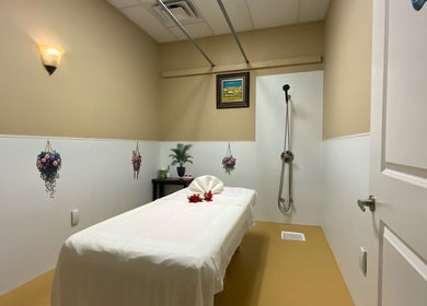 Relaxing massage room at Warm Foot Spa, Atascadero, California, US with a plush massage table and calming decor.
