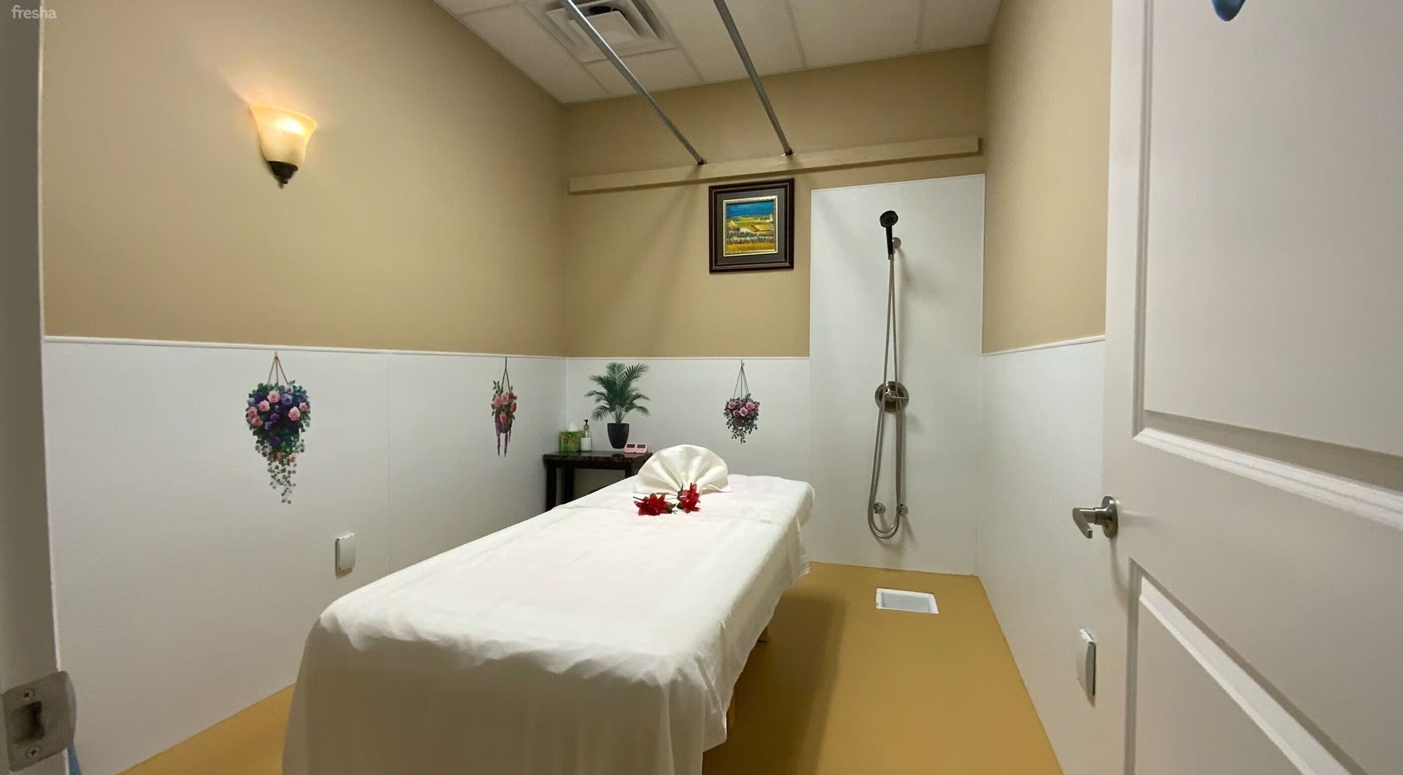 Relaxing massage room at Warm Foot Spa, Atascadero, California, US with a plush massage table and calming decor.