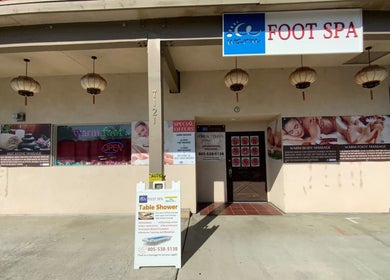 Front view of Warm Foot Spa in Atascadero, California, US, featuring welcoming signs and traditional décor.