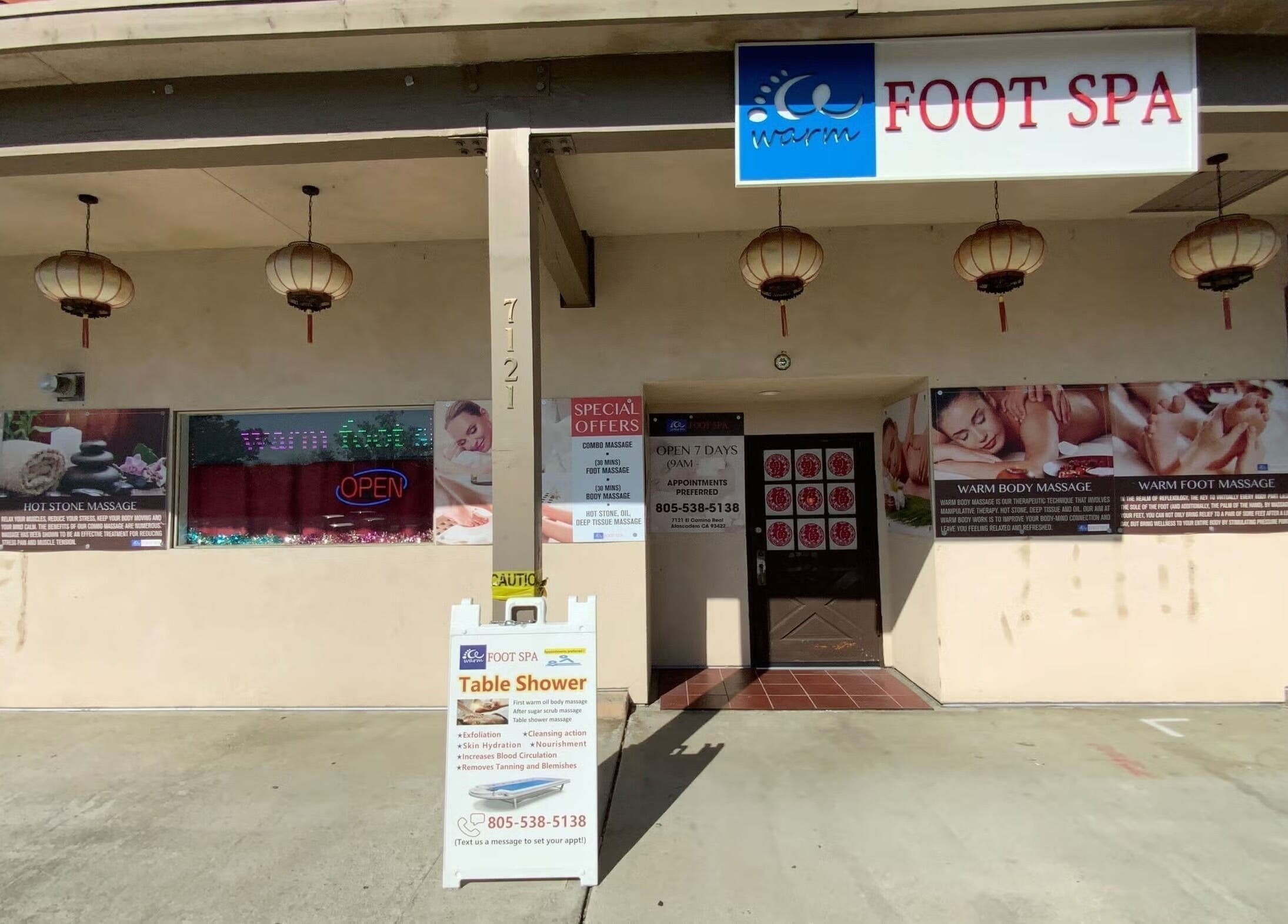 Front view of Warm Foot Spa in Atascadero, California, US, featuring welcoming signs and traditional décor.
