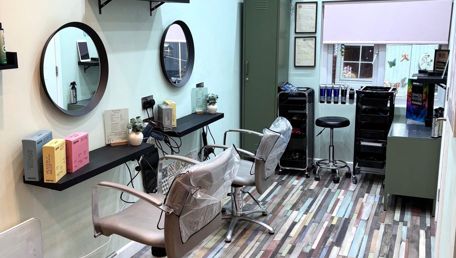 Modern styling area in Secret Sanctuary, Park Gate, England, GB with mirrors and hairdressing equipment.