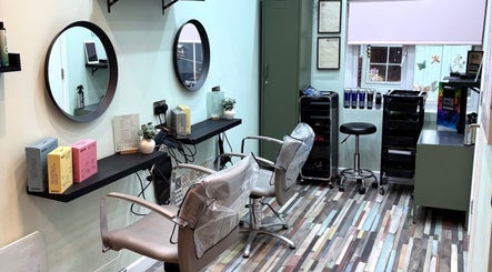 Modern styling area in Secret Sanctuary, Park Gate, England, GB with mirrors and hairdressing equipment.