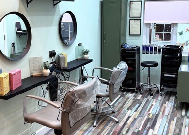 Modern hair salon at Secret Sanctuary, Park Gate, England, GB with stylish decor and salon chairs.