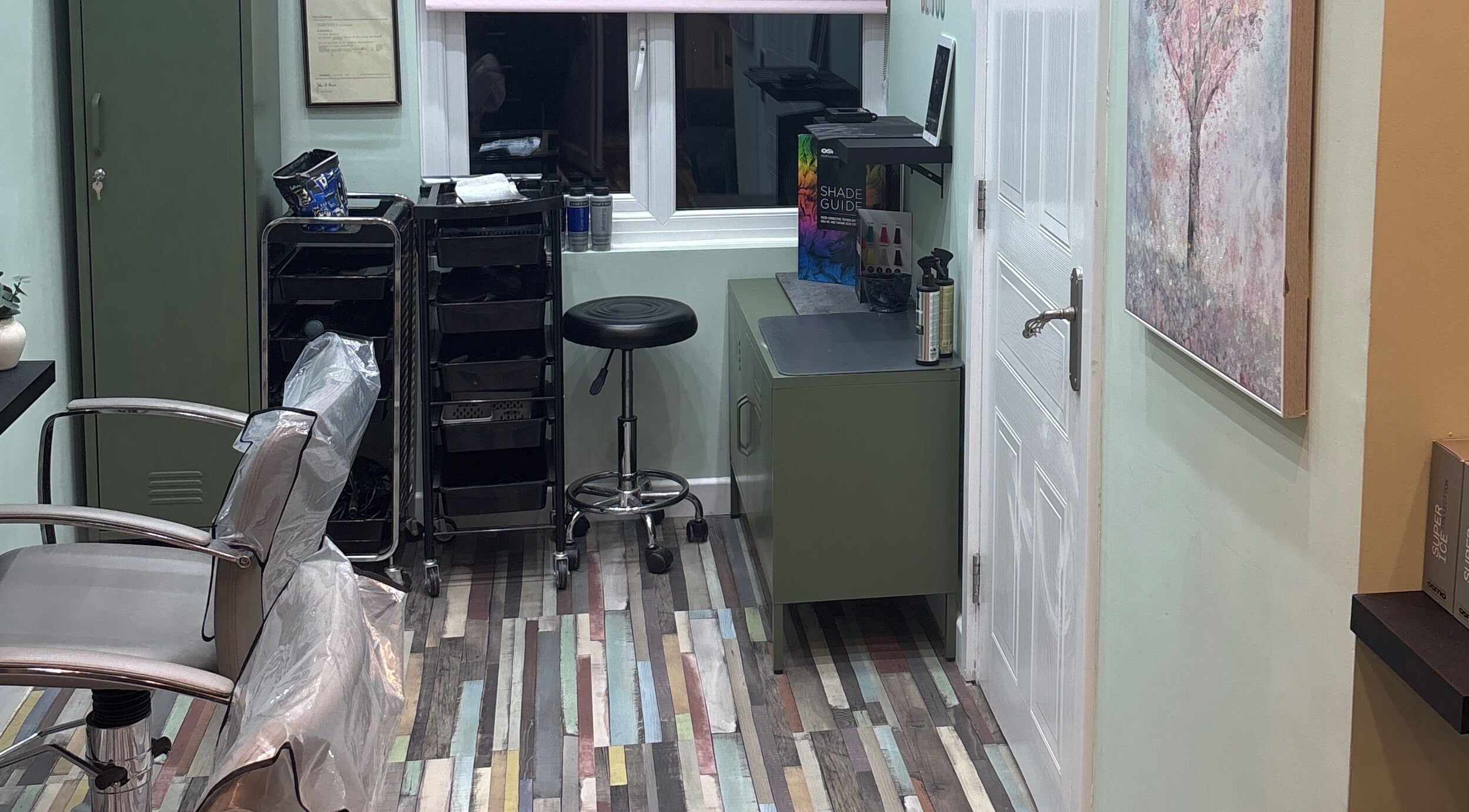 Stylish salon setup at Secret Sanctuary, Park Gate, England, GB with modern equipment and vibrant decor.