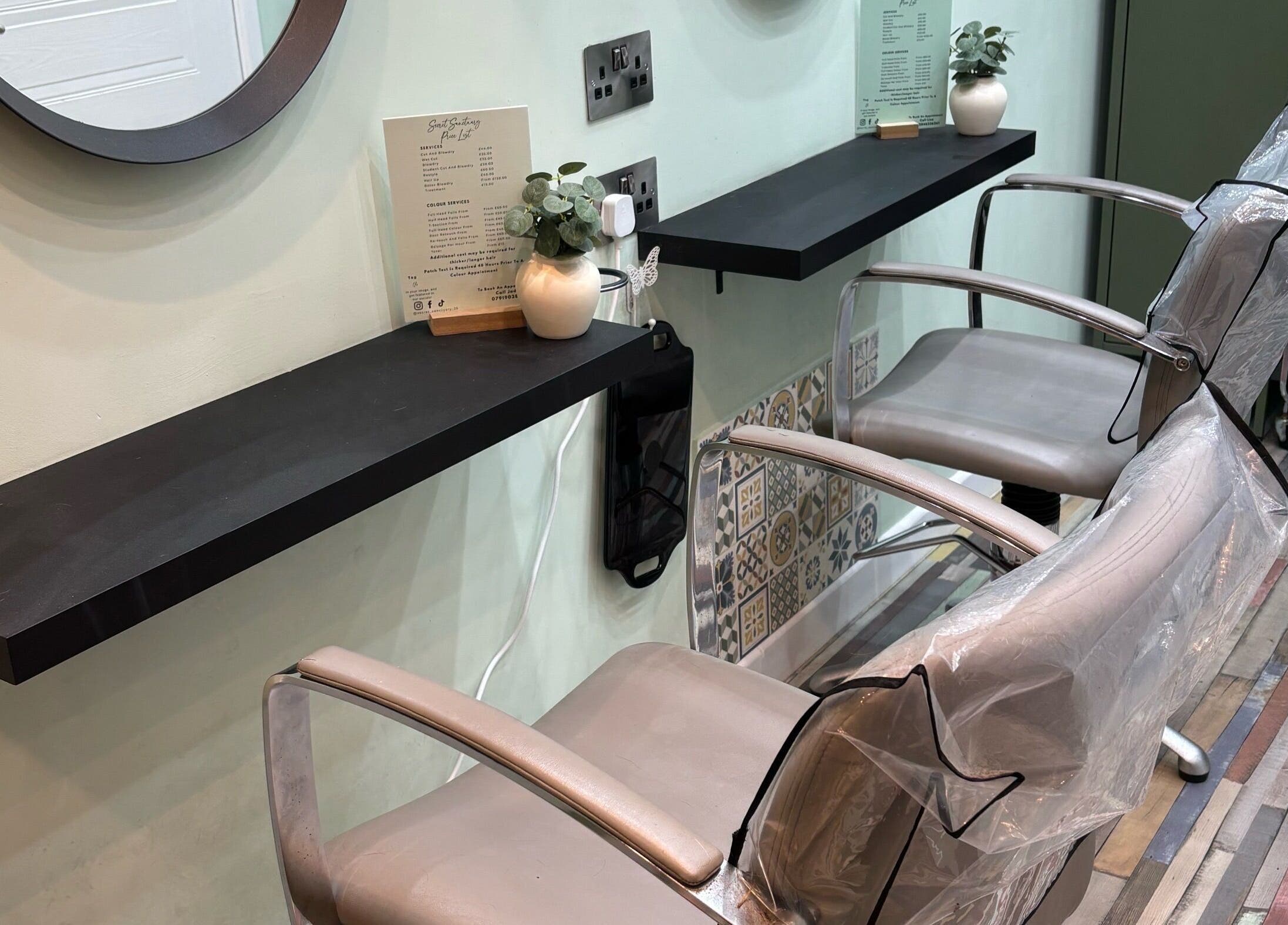 Elegant salon chairs at Secret Sanctuary, Park Gate, England, GB, offering a serene beauty experience.