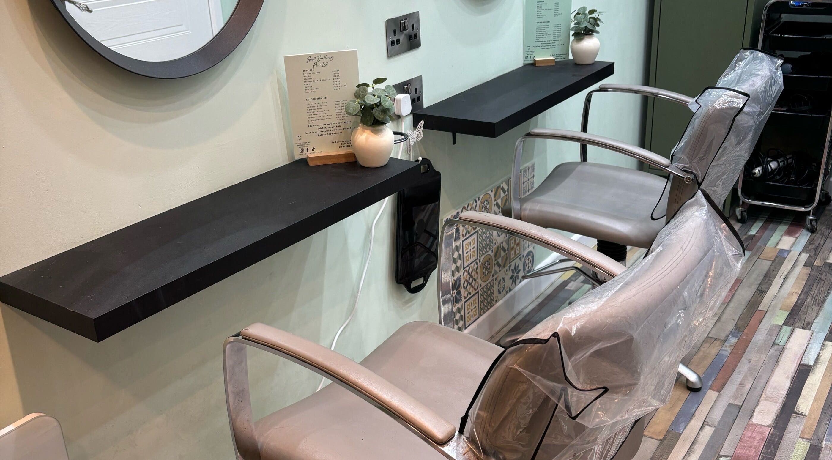 Elegant salon chairs at Secret Sanctuary, Park Gate, England, GB, offering a serene beauty experience.