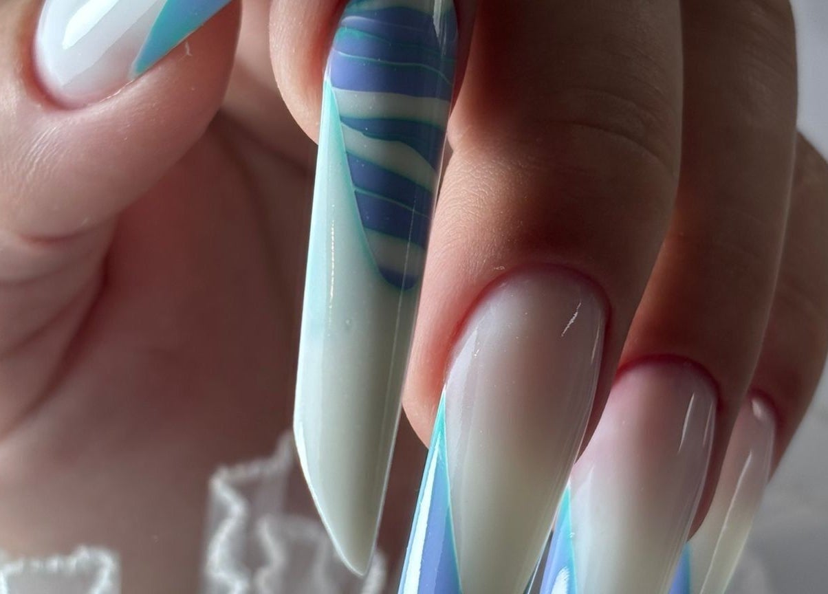 Stunning nail art with blue accents at Giulia Nails Atelier, Norwich, England, GB.