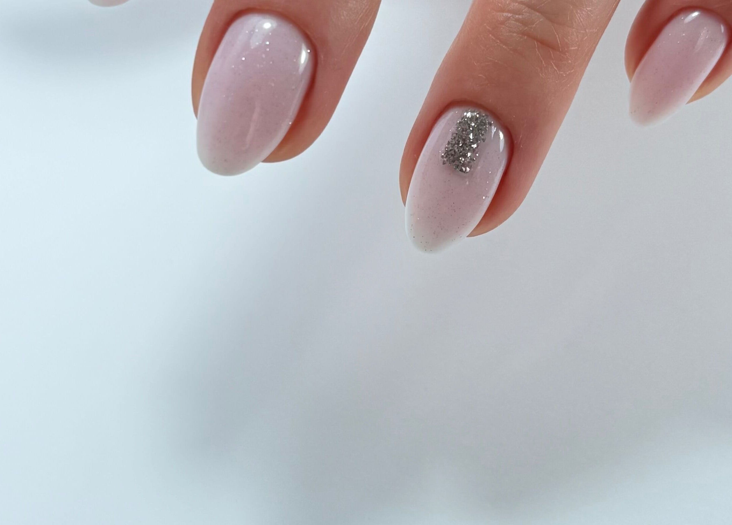 Elegant pink and glitter nail art at Giulia Nails Atelier, Norwich, England, GB.