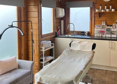 Beau Boutique treatment room in Clovenfords, Scottish Borders, GB with a cozy bed and serene ambience.