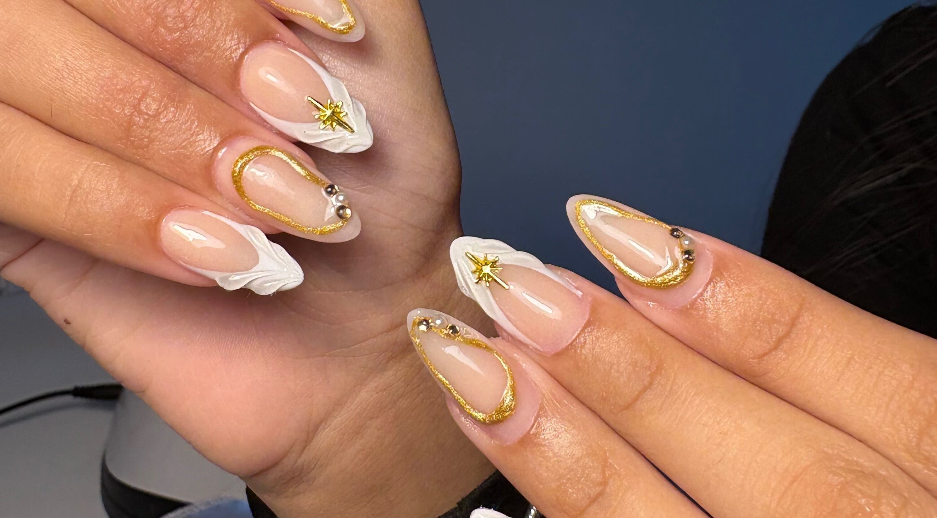 Elegant gold-accented nails at xx.madebybia in Peterborough, England, GB.