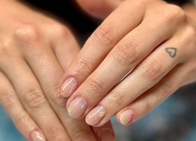 Close-up of hands with floral nail art at Skyhawk Beauty, Christchurch, Canterbury, NZ.