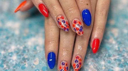 Colorful nail art showcasing red and blue designs at Skyhawk Beauty, Christchurch, Canterbury, NZ.