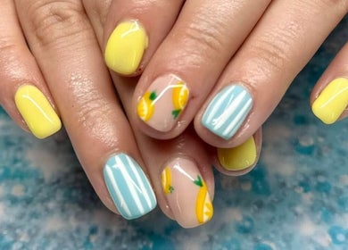 Bright lemon-themed nail art at Skyhawk Beauty, Christchurch, Canterbury, NZ. Perfect summer style.