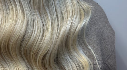 Flowing blonde hair extensions at AIM Hair Extensions, Kessingland, England, GB.