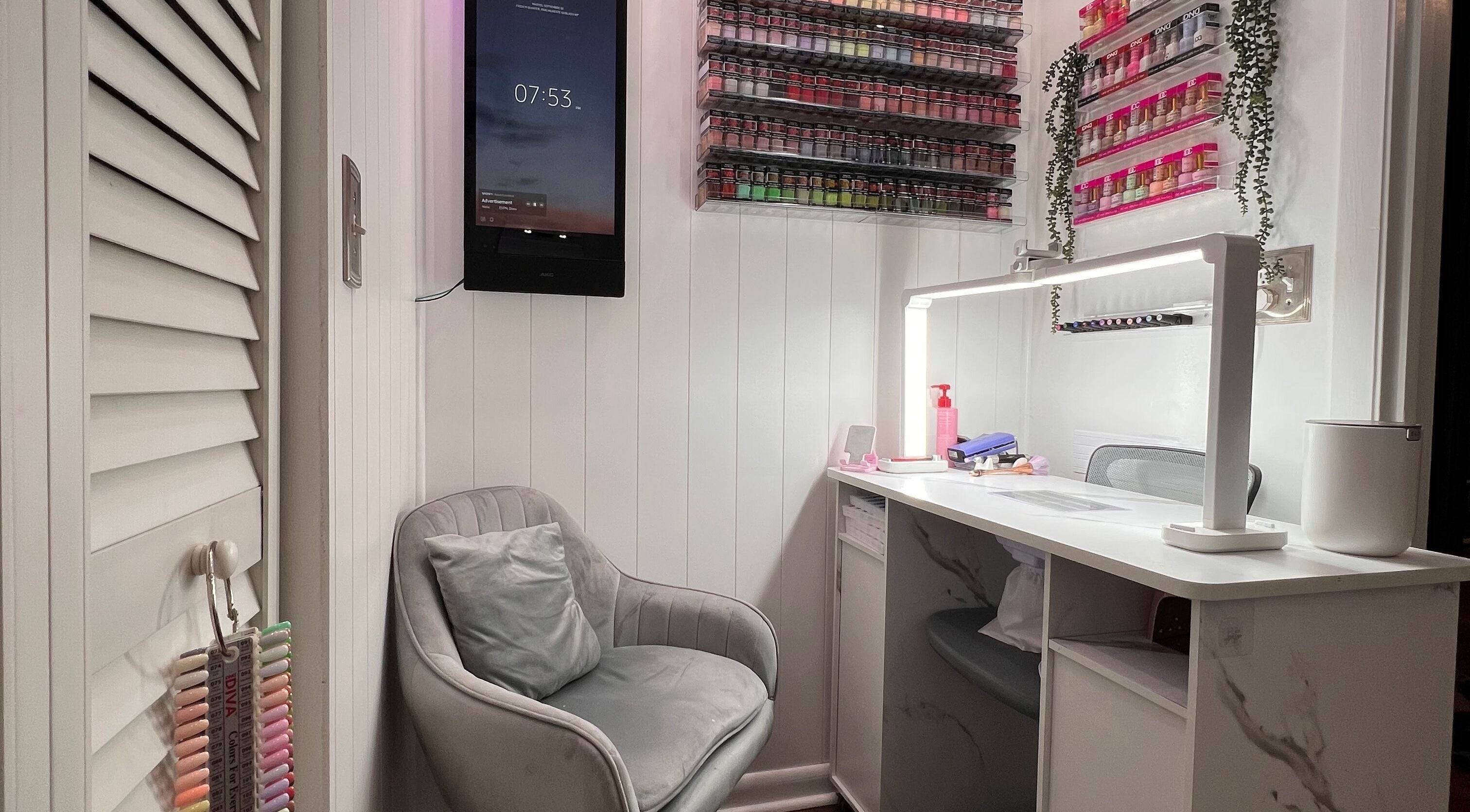 Cozy nail beauty corner at Carolinailedit, Wellington, Florida, US, with a modern chair and organized supplies.