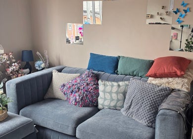 Cozy seating area with decorative cushions at Sanctuary by Nymeria | Nymeria UK, Barnsley, England, GB.