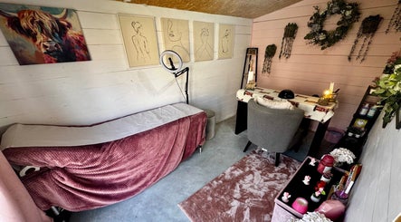 Cozy treatment room at Pixie Glow Aesthetics, Harlow, England, GB, with soothing decor and plush pink accents.