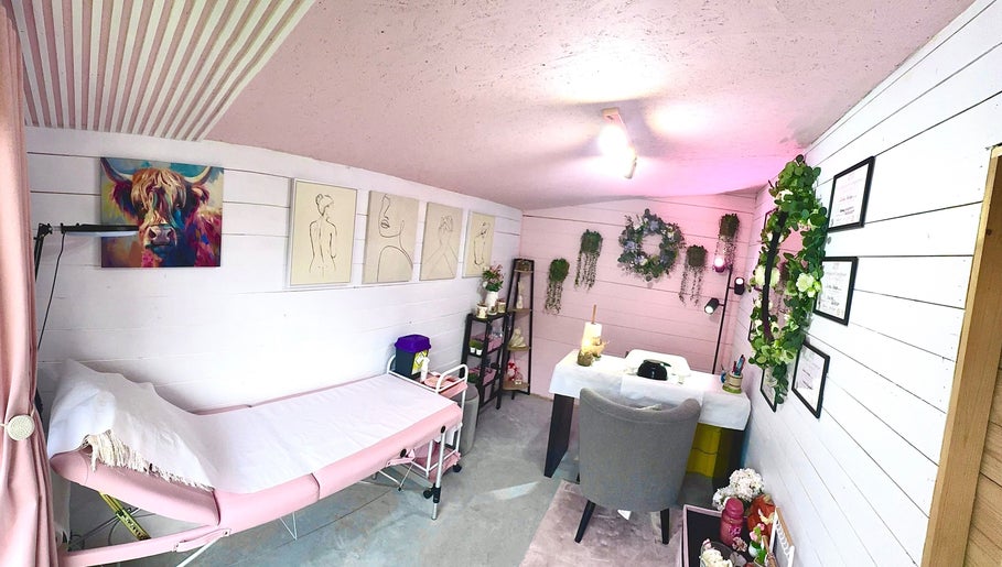 Cozy treatment room at Pixie Glow Aesthetics, Harlow, England, GB adorned with art and greenery.