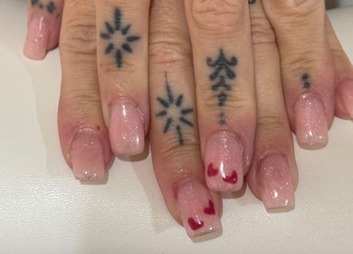 Elegant pink manicure with heart art at Pixie Glow Aesthetics, Harlow, England, GB.