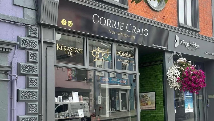 Exterior of Rebekah Whiteside Hair in Donaghadee, Northern Ireland, GB with stylish signage and floral decor.