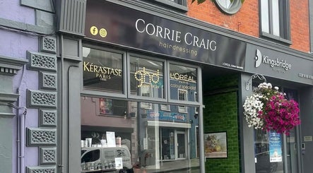 Exterior of Rebekah Whiteside Hair in Donaghadee, Northern Ireland, GB with stylish signage and floral decor.