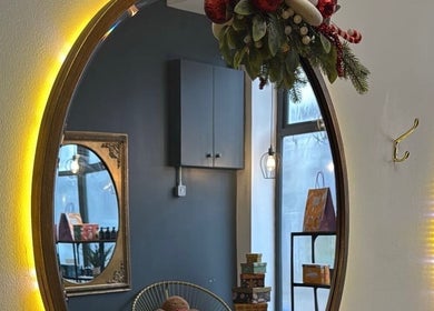 Warm-lit mirror at Rebekah Whiteside Hair, Donaghadee, Northern Ireland, GB, showcasing cozy decor.