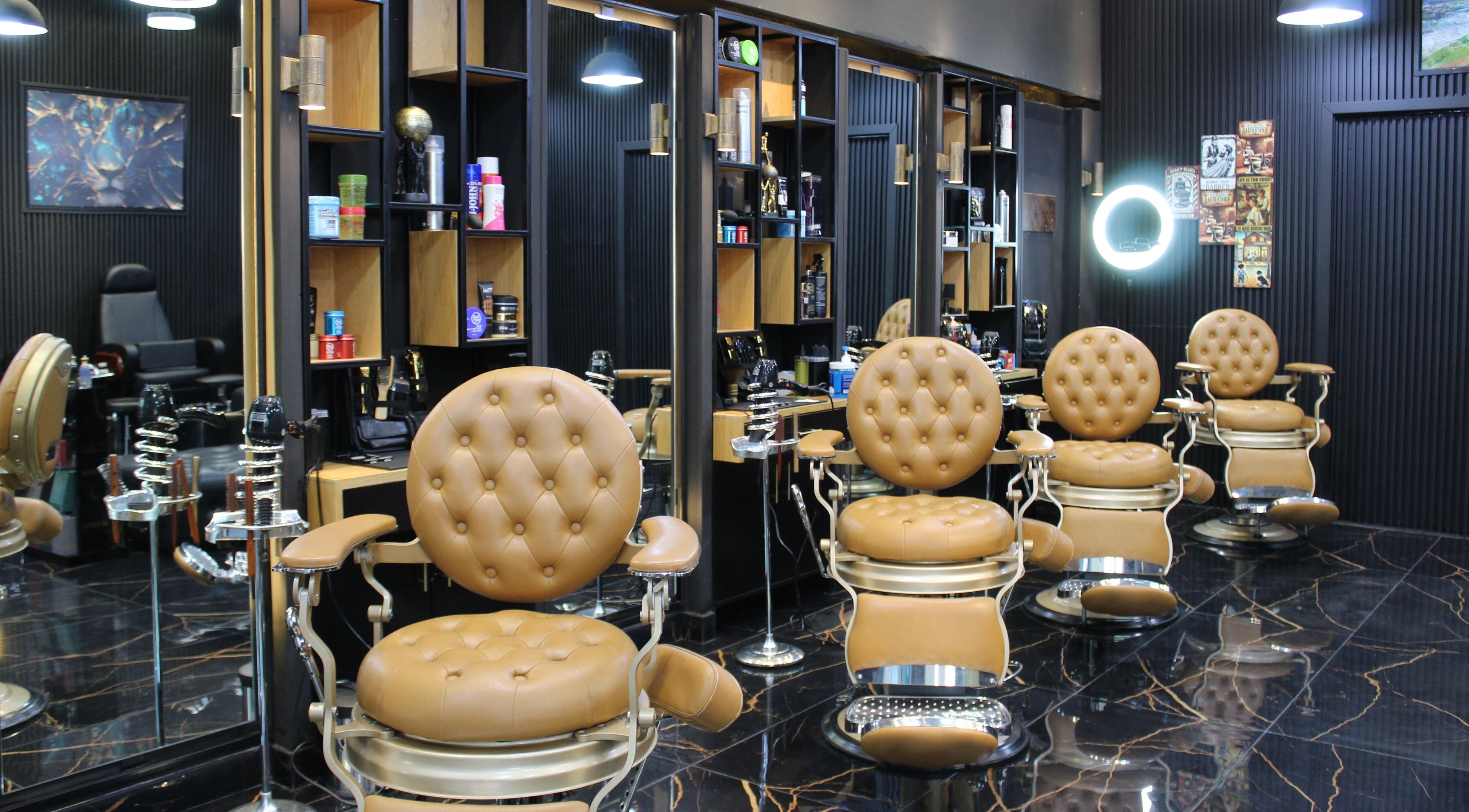 Luxurious barber chairs at Tiger Gents Salon, Dubai, AE with modern decor and organized workspace.