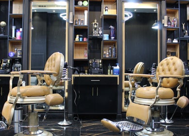 Luxurious salon interior with plush chairs at Tiger Gents Salon, Dubai, AE.