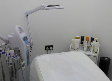 Treatment room at Tiger Gents Salon, Dubai, AE with skincare products and equipment for beauty services.