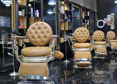 Elegant barber chairs at Tiger Gents Salon, Dubai, AE. Experience superior grooming in style.