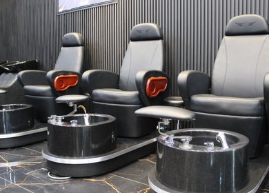 Luxurious pedicure chairs at Tiger Gents Salon, Dubai, AE offer a premium relaxation experience.