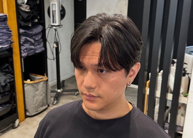 Man with trendy hairstyle at King Chan, 香港島, 香港島, HK, showcasing salon interior.