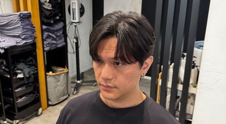 Man with trendy hairstyle at King Chan, 香港島, 香港島, HK, showcasing salon interior.