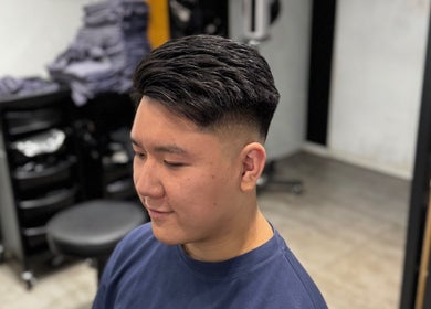 Modern fade haircut at King Chan, 香港島, 香港島, HK. Fresh style in a professional salon setting.