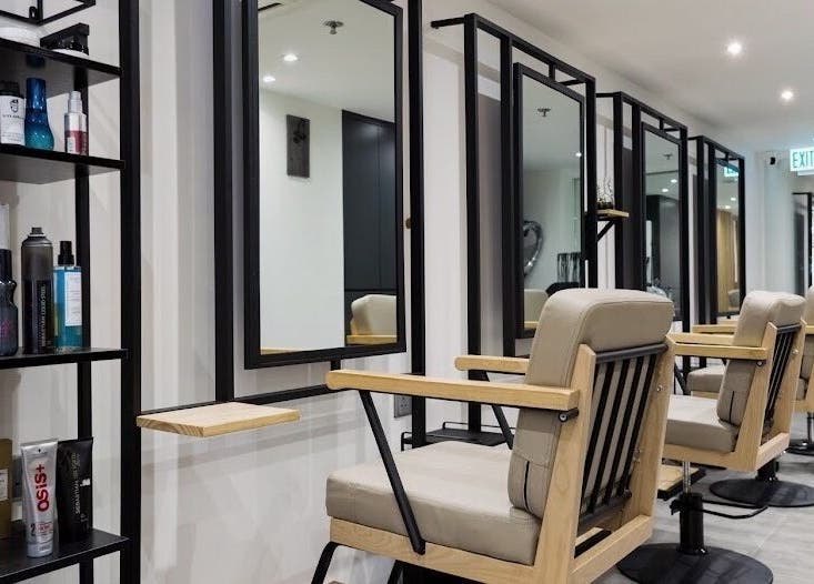 Stylish salon chairs at King Chan, 香港島, 香港島, HK, showcasing a modern beauty and wellness interior.