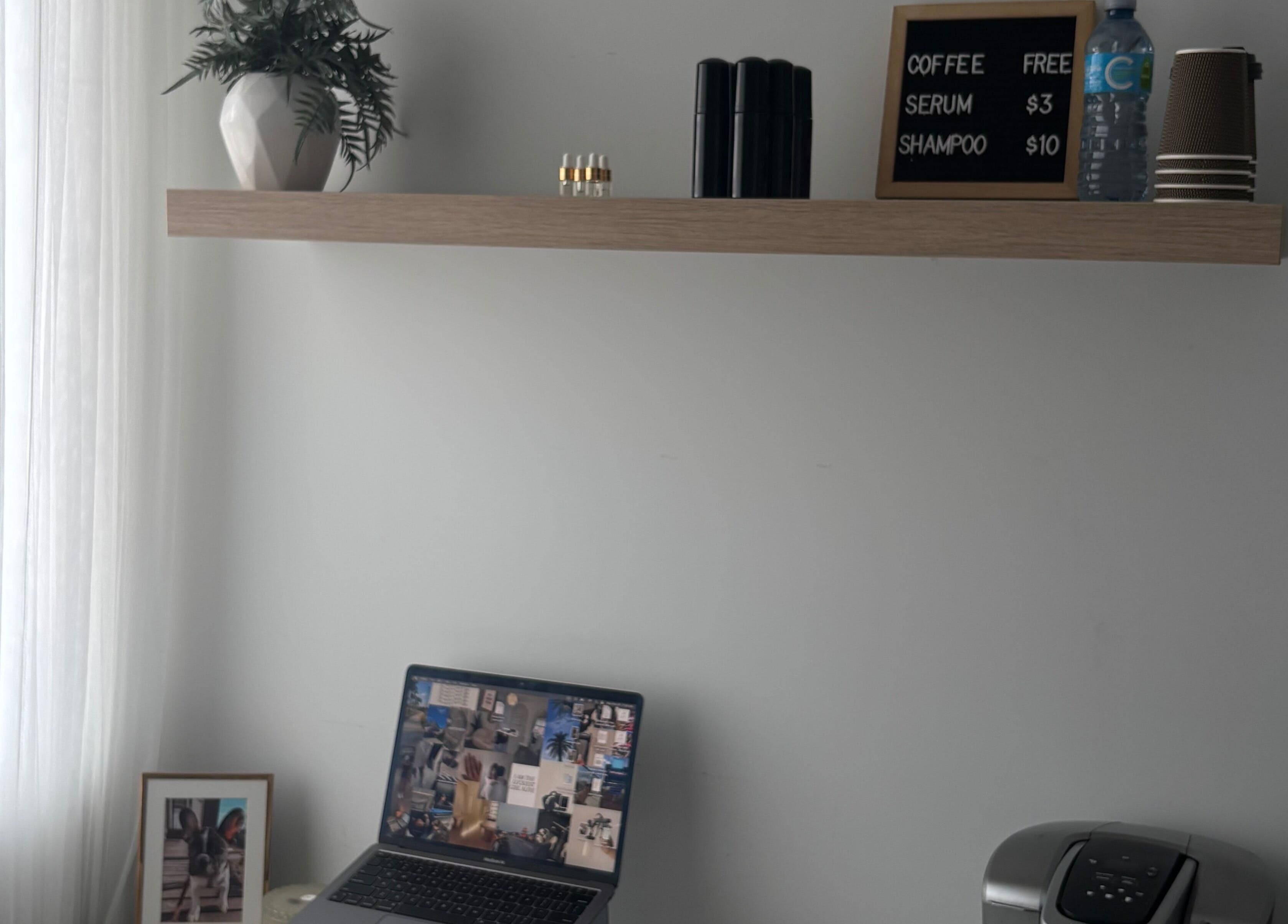 Minimalist workspace with laptop at Sophie's Beauty Lounge, Longueuil, Québec, CA.