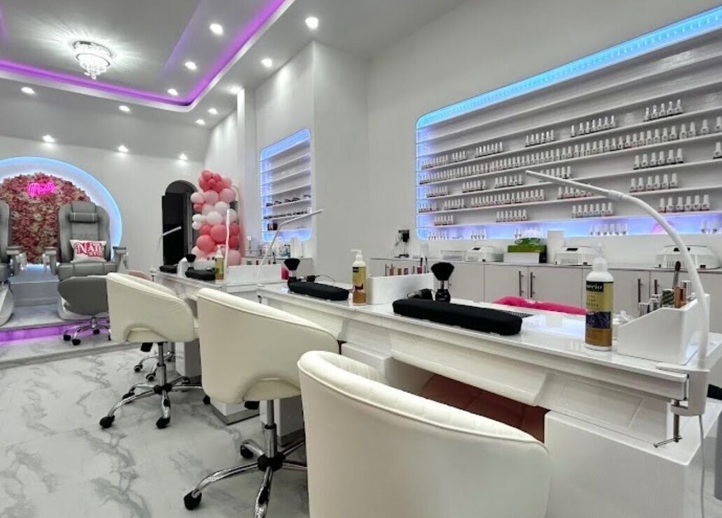 Elegant interior of The Nail Stop in Oldbury, England, GB, featuring plush pedicure chairs and ambient lighting.