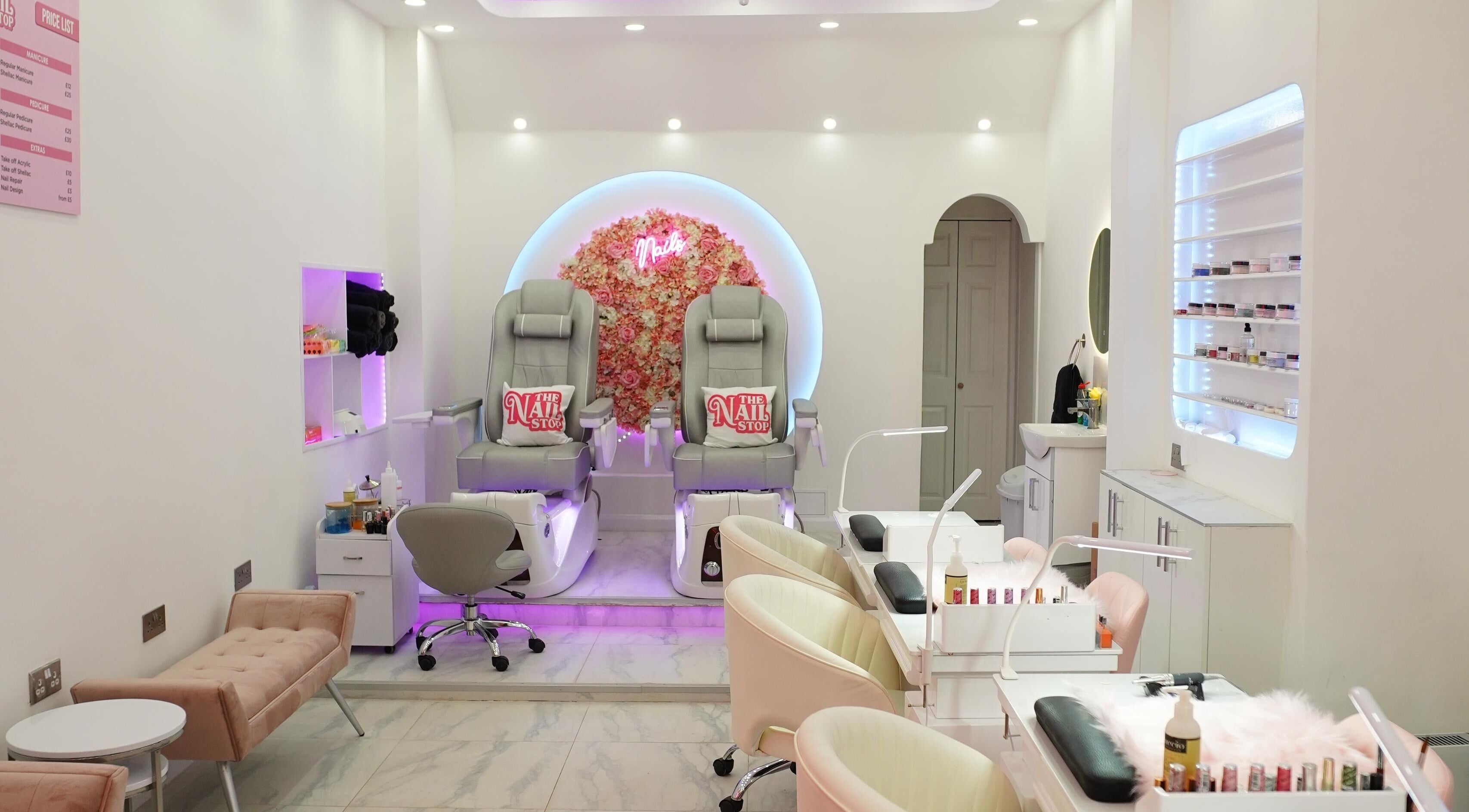 Elegant interior of The Nail Stop, Oldbury, England, GB featuring plush pedicure chairs and stylish decor.