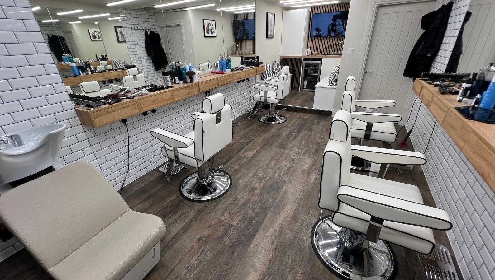 Modern barber chairs and mirrors at Atelier Barber Co, Bearsden, Scotland, GB.