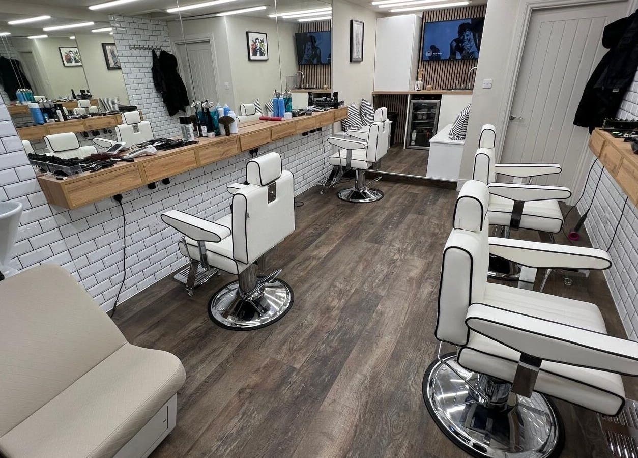 Modern barber chairs and mirrors at Atelier Barber Co, Bearsden, Scotland, GB.