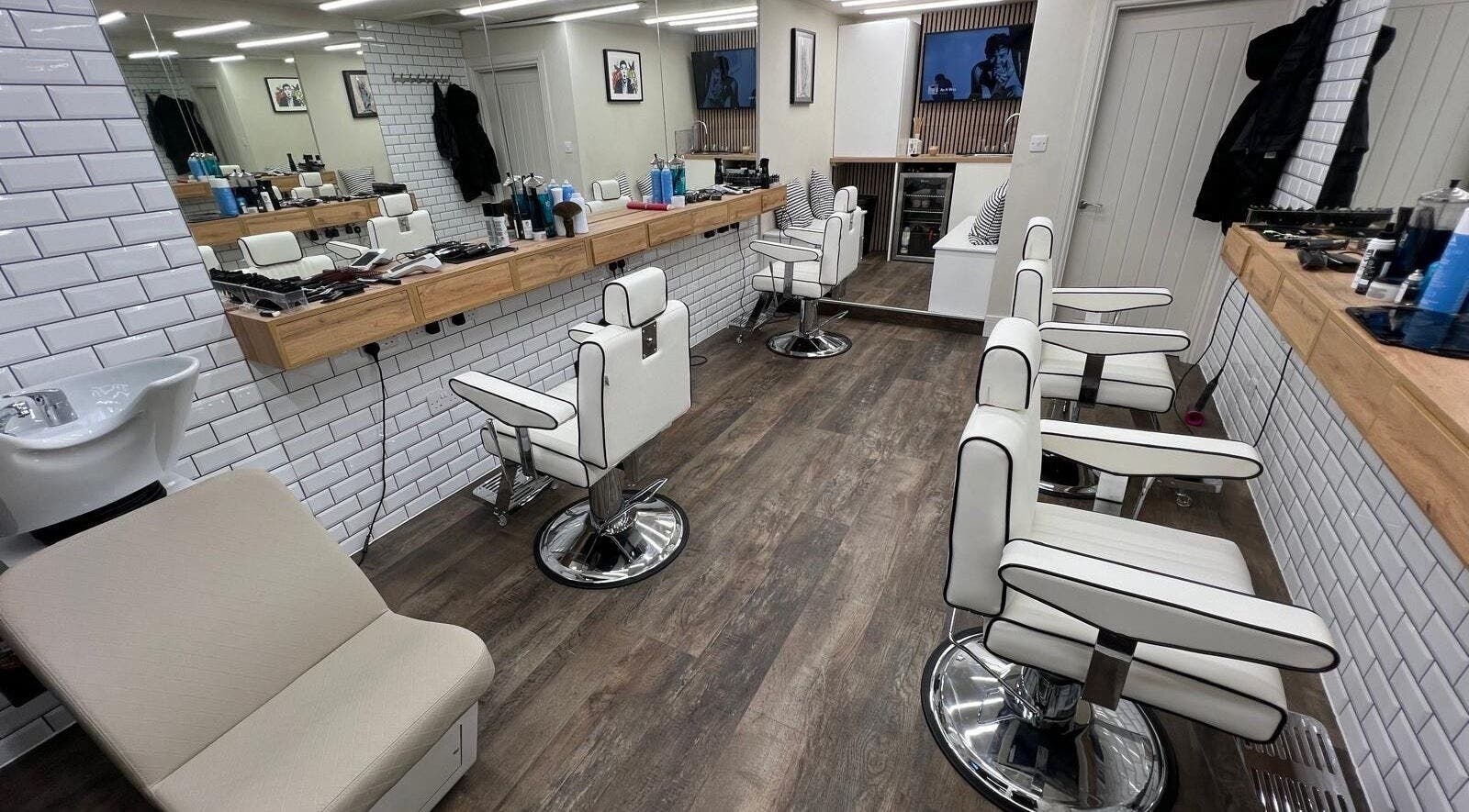 Modern barber chairs and mirrors at Atelier Barber Co, Bearsden, Scotland, GB.
