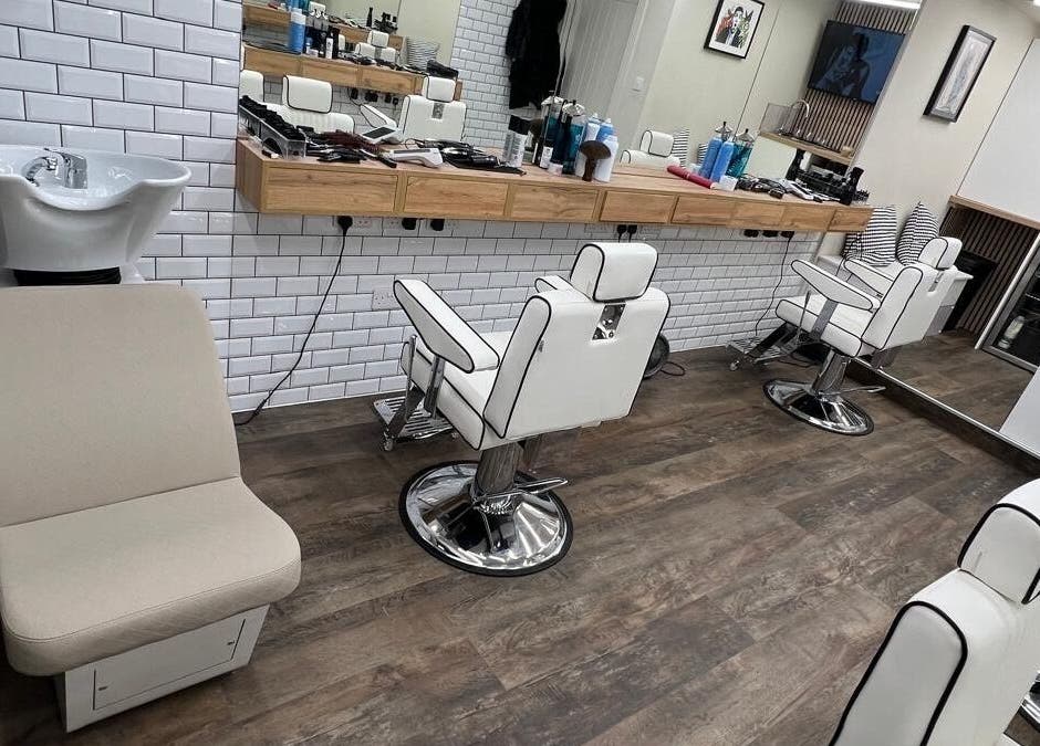Modern barber chairs and sinks at Atelier Barber Co, Bearsden, Scotland, GB.