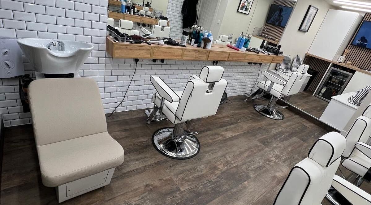 Modern barber chairs and sinks at Atelier Barber Co, Bearsden, Scotland, GB.