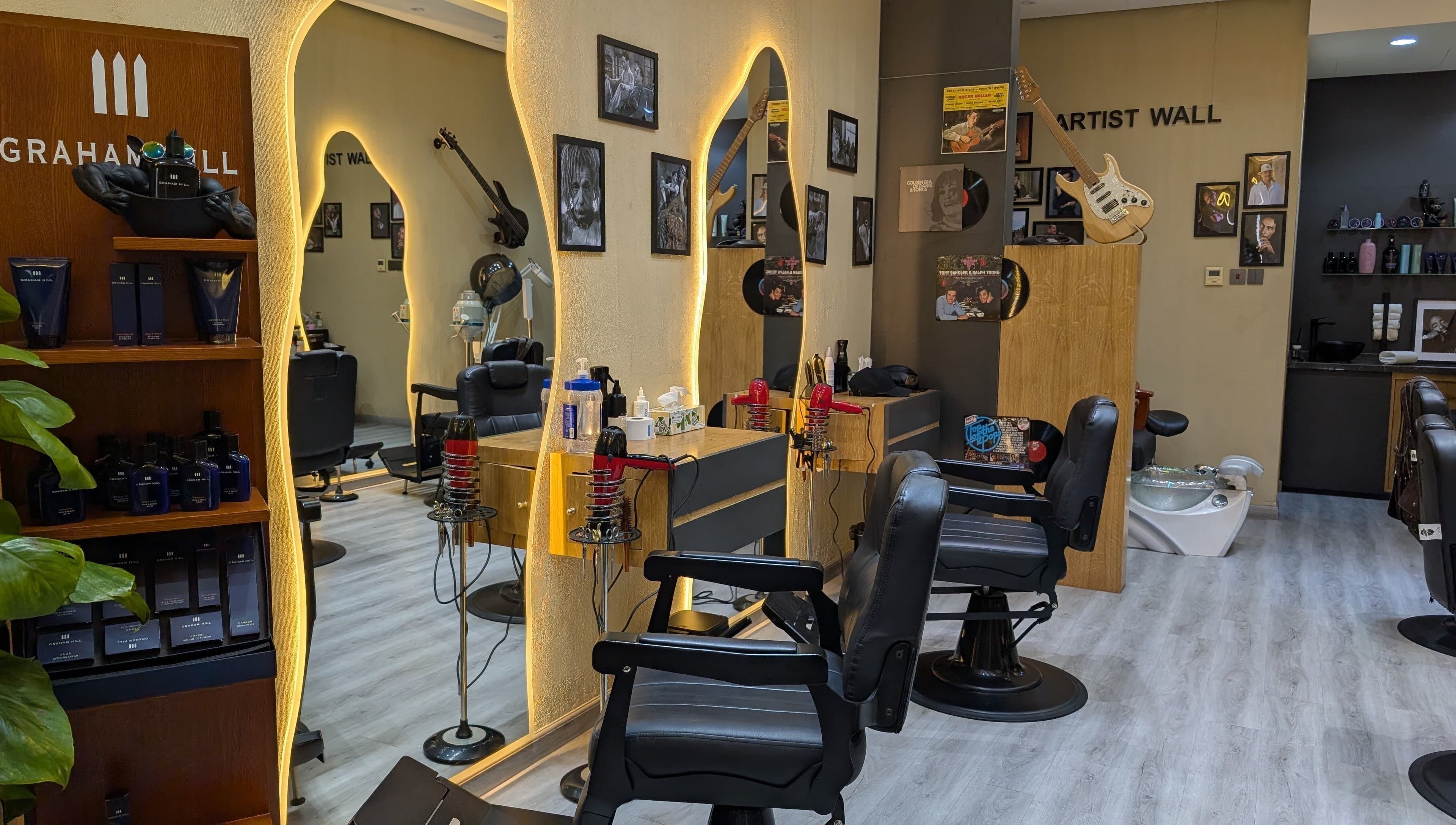 Elegant interior of Bab Al Rayyan Gents Salon in Dubai, AE, showcasing stylish barber chairs and decor.