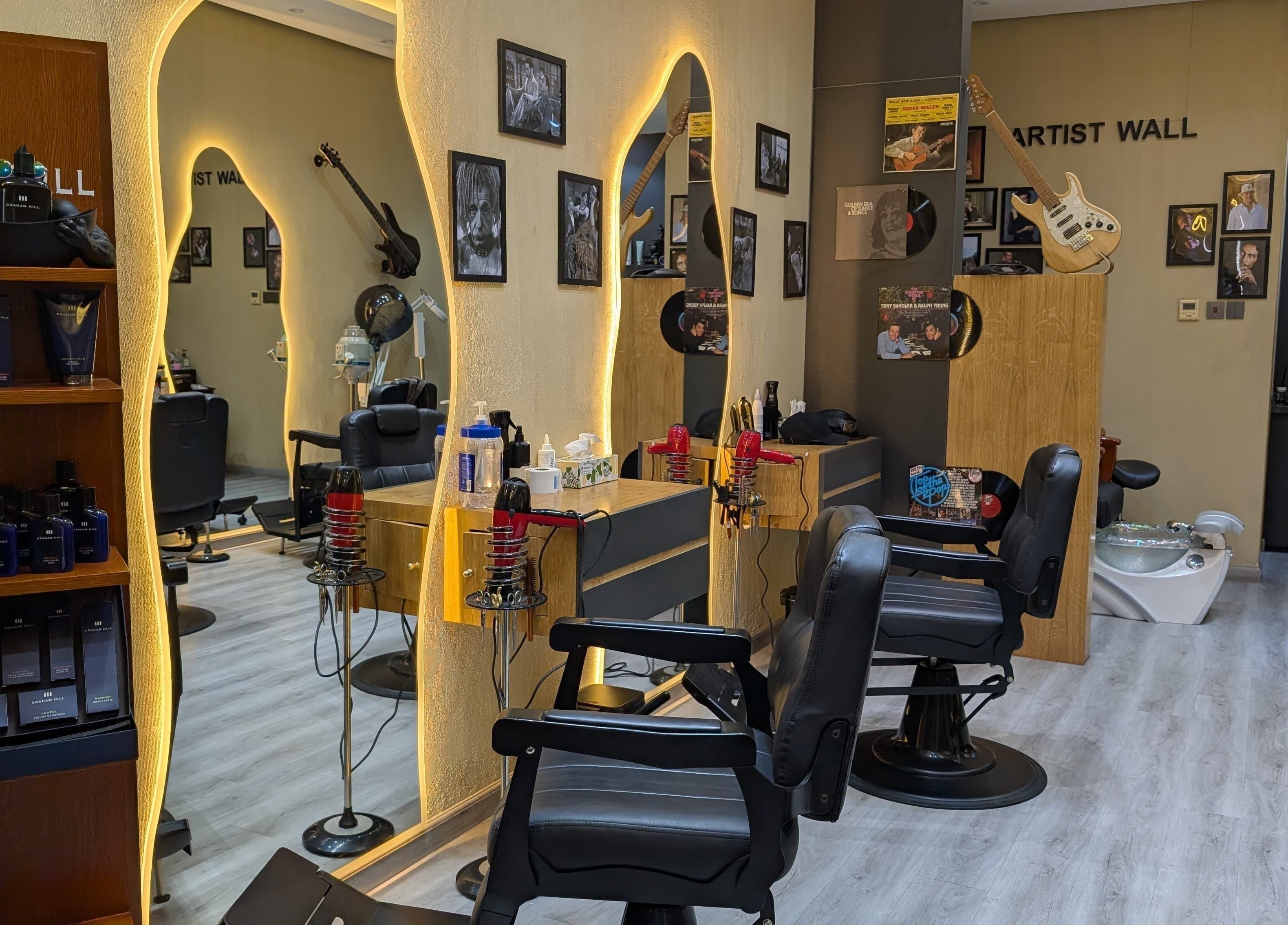 Elegant interior of Bab Al Rayyan Gents Salon in Dubai, AE, showcasing stylish barber chairs and decor.