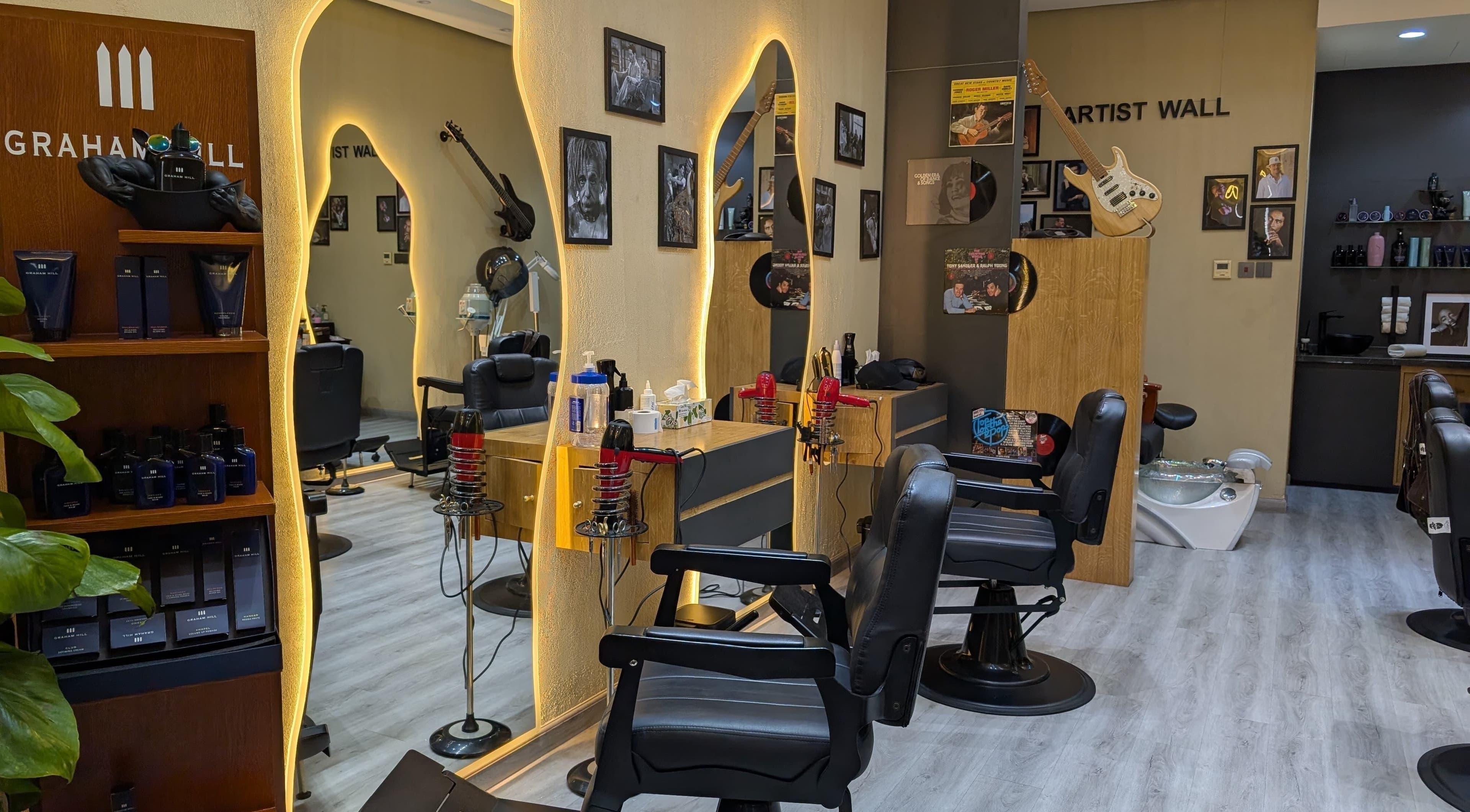 Elegant interior of Bab Al Rayyan Gents Salon in Dubai, AE, showcasing stylish barber chairs and decor.