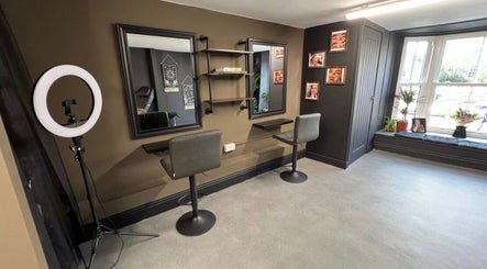 Modern styling area at Retro Rose Hair & Beauty in Guisborough, England, GB with sleek mirrors and chairs.